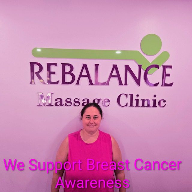 Rebalance Massage Clinic staffer wears pink in support of Breast Cancer Awareness Month