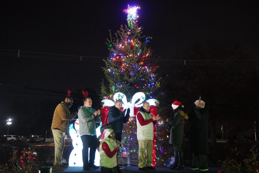 Township Council members clap as the Christmas tree lights up marking the official start of the holiday season!